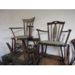 Two Edwardian beechwood spindle back open elbow chairs