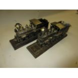 Two metal table cigarette lighters in the form of steam engine locomotives