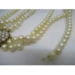 Triple row uniform cultured pearl necklace with a 9ct gold clasp