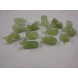 Group of twelve small carved jadeite figures of animals representing the Chinese year, snake, rat,