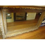 Large 19th Century rectangular gilt moulded composition wall mirror, 34ins x 53ins