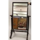 William IV mahogany rectangular swing frame cheval mirror, the moulded uprights above baluster