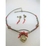 Silver plated bangle and a silver and coral necklet and earrings