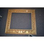 Rectangular gilt picture frame with applied C-scroll decoration, aperture 23.5ins x 20ins