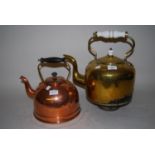 Large brass kettle with ceramic handle together with a smaller copper kettle