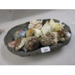 Small quantity of various sea shells and an oval stone dish