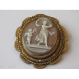 Large 19th Century gold plated cameo with swivel centre depicting a lady and child