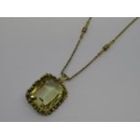 Large 18ct gold mounted citrine pendant suspended on a 9ct gold chain