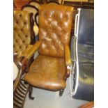 19th Century mahogany and button leather upholstered open armchair, raised on turned tapering
