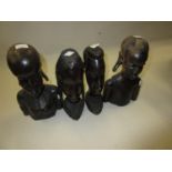 Pair of 20th Century African carved hardwood busts, 8.5ins high, together with a similar smaller