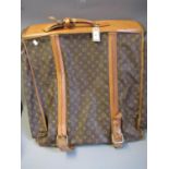 Louis Vuitton, folding suit carrier with leather straps and leather handles (wear from use)