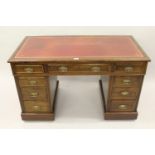 Late 19th Century walnut twin pedestal desk with a red tooled leather inset top 74cms high x