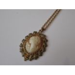 9ct Gold mounted carved shell cameo portrait pendant, suspended from an unmarked chain