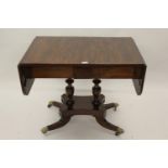 Regency mahogany drop-leaf sofa table with two frieze drawers, raised on baluster turned supports