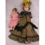 Wax head doll with wax limbs and a pink crochet dress, 16.5ins high, together with another similar