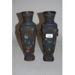 Pair of 20th Century Chinese dark patinated bronze two handled baluster form vases decorated in