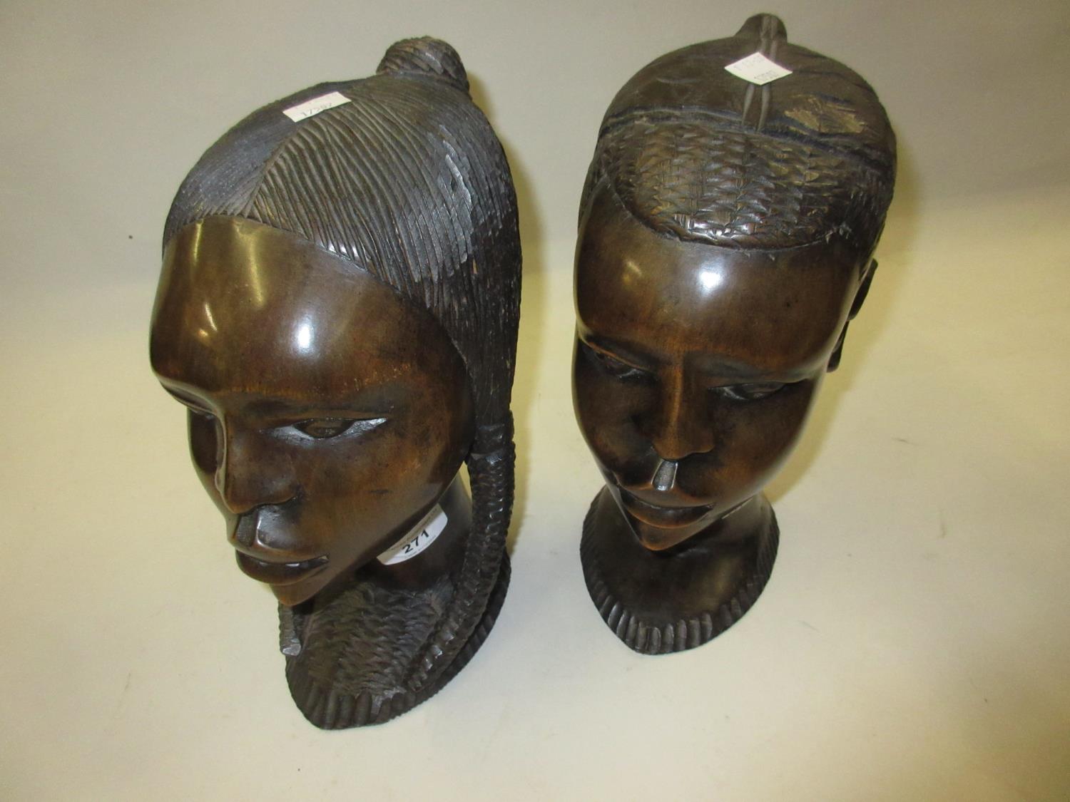 Pair of 20th Century African carved hardwood busts, 9.5ins high