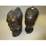 Pair of 20th Century African carved hardwood busts, 9.5ins high