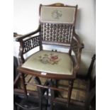 Edwardian mahogany and inlaid drawing room armchair with pierced back and sides and needlepoint