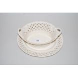 Leeds pottery creamware strawberry basket of typical two handled pierced design with stand,