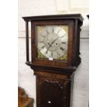 George III oak and mahogany longcase clock, the square hood above an arched panelled door and