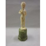 Ferdinand Preiss, small Art Deco carved ivory figure of a nude boy playing a horn mounted on an onyx