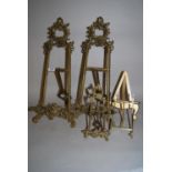 Pair of reproduction brass table top display easels, 20ins high together with another similar, 9.