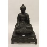 Brown patinated bronze seated Buddha figure, 26.5ins high