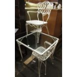 White metal and glass garden table together with four chairs