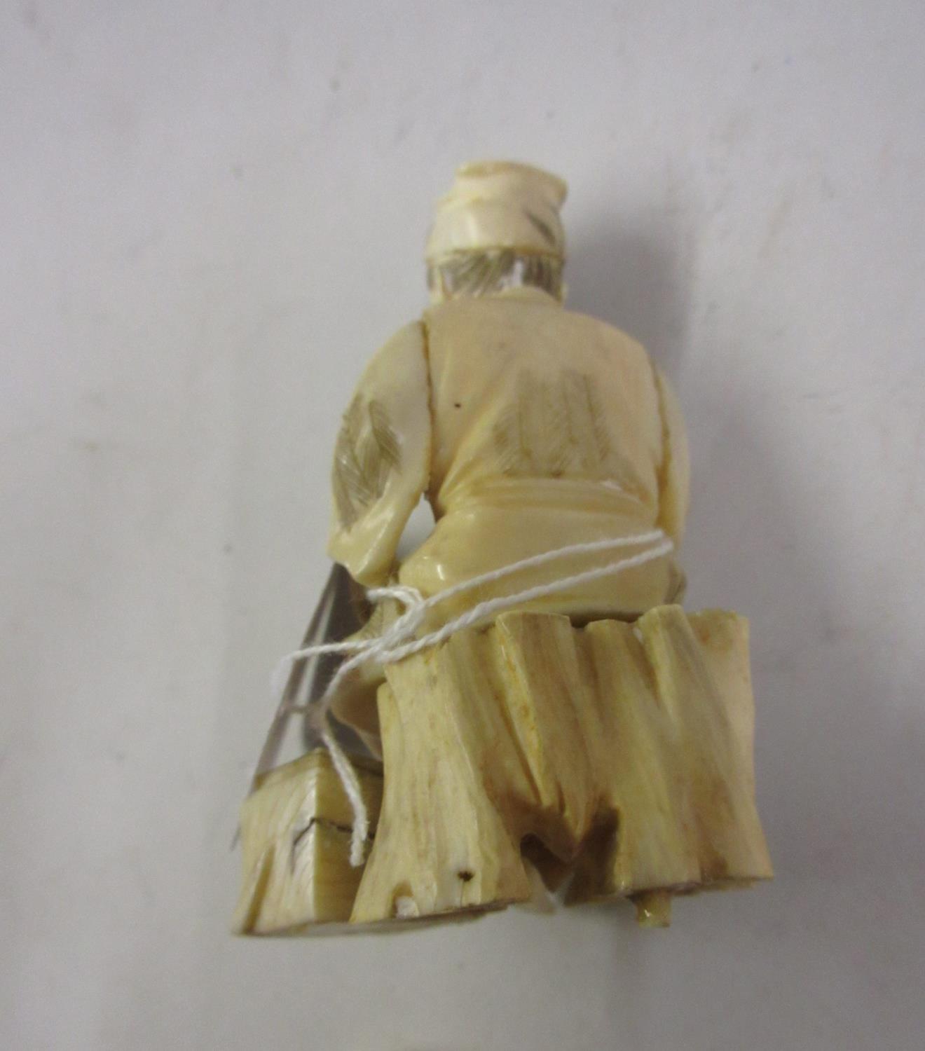Small 19th Century Japanese carved ivory figure of a seated tradesman, red seal mark to base (at - Image 3 of 3