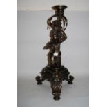 20th Century patinated brass candle stand / lamp base in the form of a putti riding a mermaid with