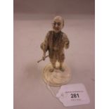 19th Century Japanese carved ivory figure of a tradesman carrying a basket and staff, signed to