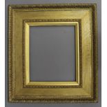 A `WATTS` STYLE PICTURE FRAME with bevelled sight, bellflower, plain frieze, and bead-and-reel below