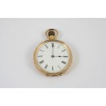 AN 18CT. GOLD OPEN FACED POCKET WATCH the white enamel dial with Roman numerals, with foliate