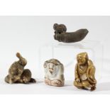 JAPANESE CARVING OF A CAT, possibly bone; a netsuke of a seated man; and two other figures (4)