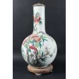 CHINESE FAMILLE ROSE BOTTLE VASE, 19th century, enamelled with pomegranates on leafing branches,