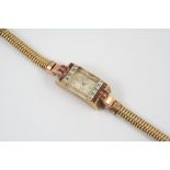 A LADY'S RUBY, DIAMOND AND GOLD DRESS WATCH the rectangular-shaped dial signed Aero, with Arabic