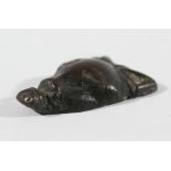 CHINESE BRONZE PLAQUE, possibly Warring States, in the form of an animal head, possibly a cat,