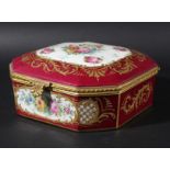 SEVRES STYLE CASKET, late 19th century, painted with floral sprays inside gilt frames on a maroon