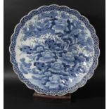 JAPANESE BLUE AND WHITE CHARGER, of foliate form, painted with a floral garden, diameter 46cm