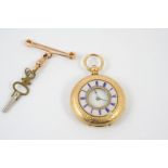 AN 18CT. GOLD HALF HUNTING CASED POCKET WATCH the white enamel dial with Roman numerals, with