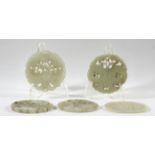 COLLECTION OF SEVEN CHINESE CELADON JADE BI DISCS, with carved and reticulated decoration in the