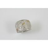 A DIAMOND AND FANCY COLOURED DIAMOND RING BY BVLGARI the 18ct white gold band is mounted to one side