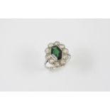 A TOURMALINE AND DIAMOND CLUSTER RING the green tourmaline is set within a surround of old