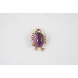 AN AMETHYST AND DIAMOND CHICK BROOCH the body mounted with an oval cabochon amethyst, the head