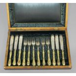 CASED SET OF JAPANESE HANDLED FISH CUTLERY, late 19th century, the brass handles cast with