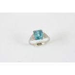 A ZIRCON AND DIAMOND RING the rectangular-shaped zircon is set with six single-cut diamonds to