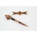 A SCOTTISH HARDSTONE AND GOLD BROOCH formed as a sword, 7.5cm long, and a Scottish hardstone and