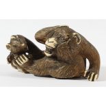 JAPANESE IVORY NETSUKE, carved as a monkey and a rat, length 8.2cm