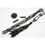 A QUANTITY OF JET JEWELLERY including a long tassel necklace, another necklace etc